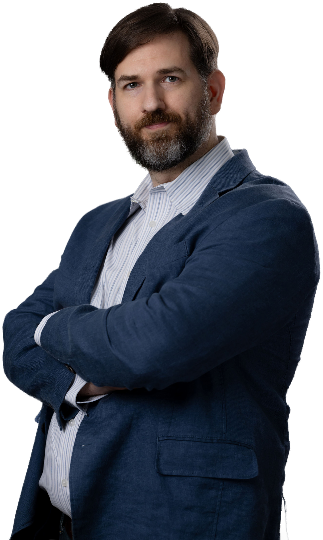 Paul David Thompson, arms crossed, in a navy blazer